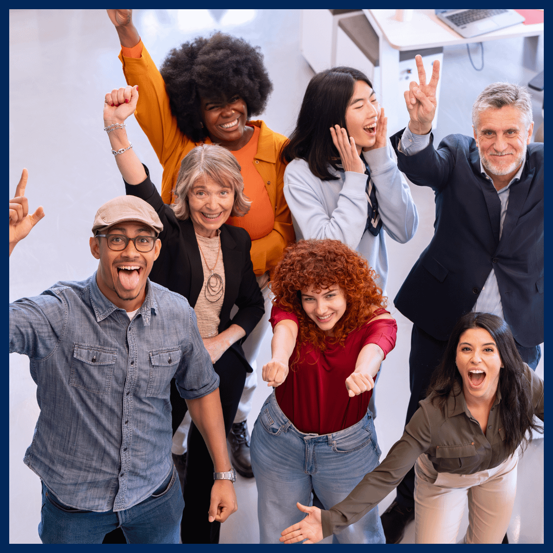 Employees cheering and smiling.