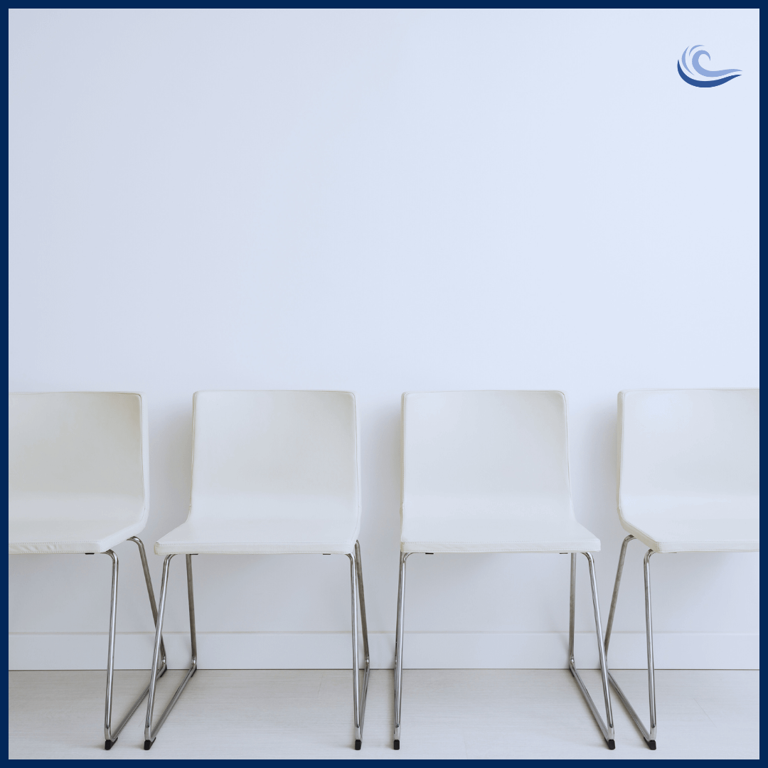 Depicting the hiring crisis through empty chairs in a waiting room.